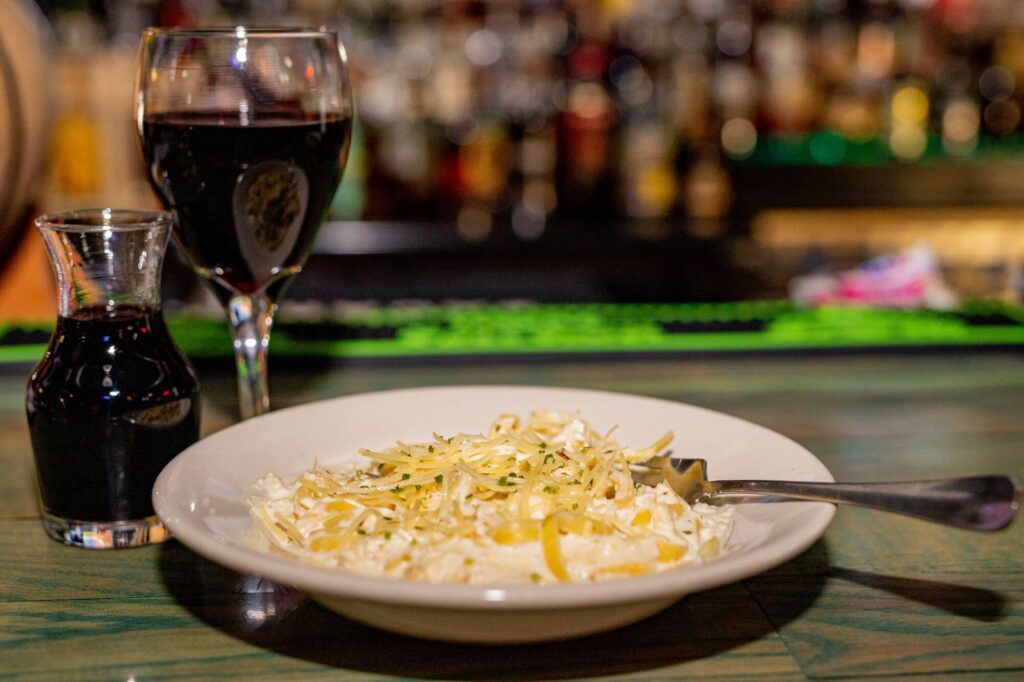 chicken alfredo pasta dinner at Dive Bar Como Columbia Missouri restaurant whiskey