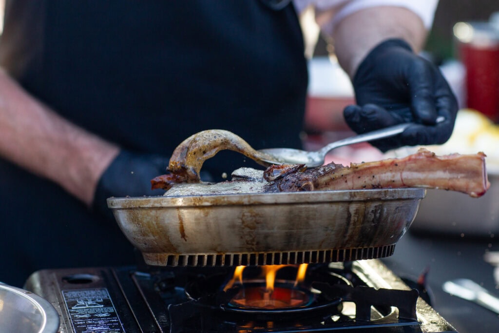 chef cooking at a chefs on fire event photo by Epicure The Event